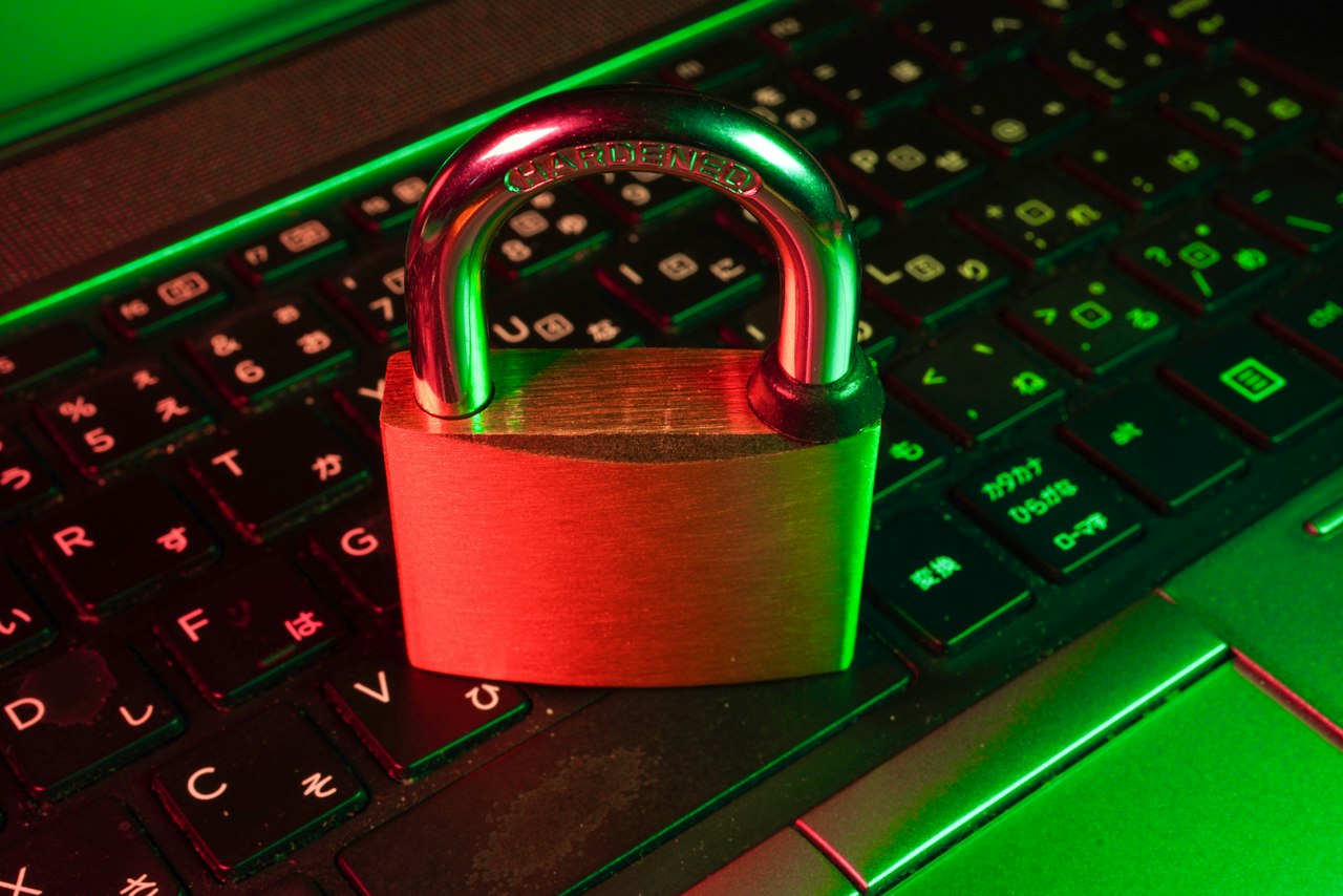 Smartphone authenticator app beside a laptop used for multi-factor sign-in