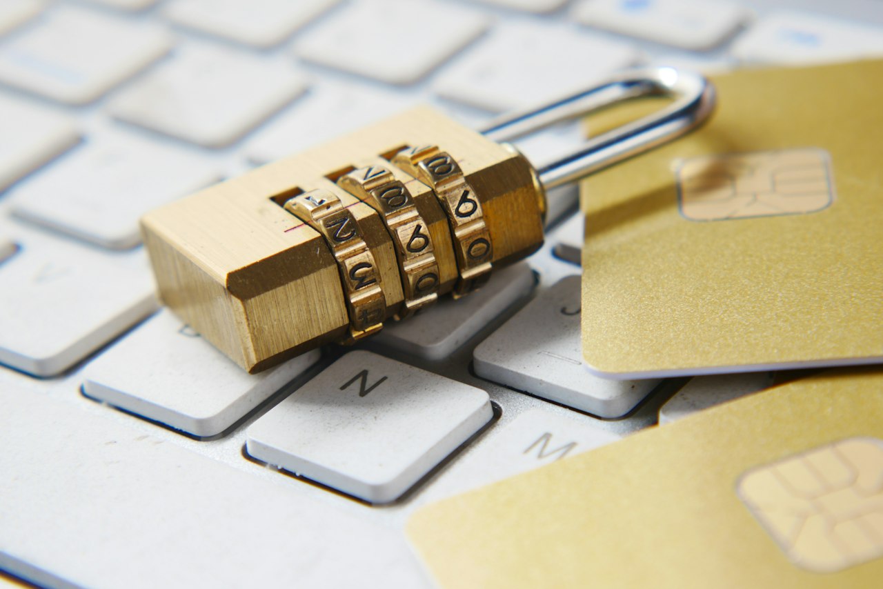 Checklist on a desk next to a laptop while evaluating password manager options